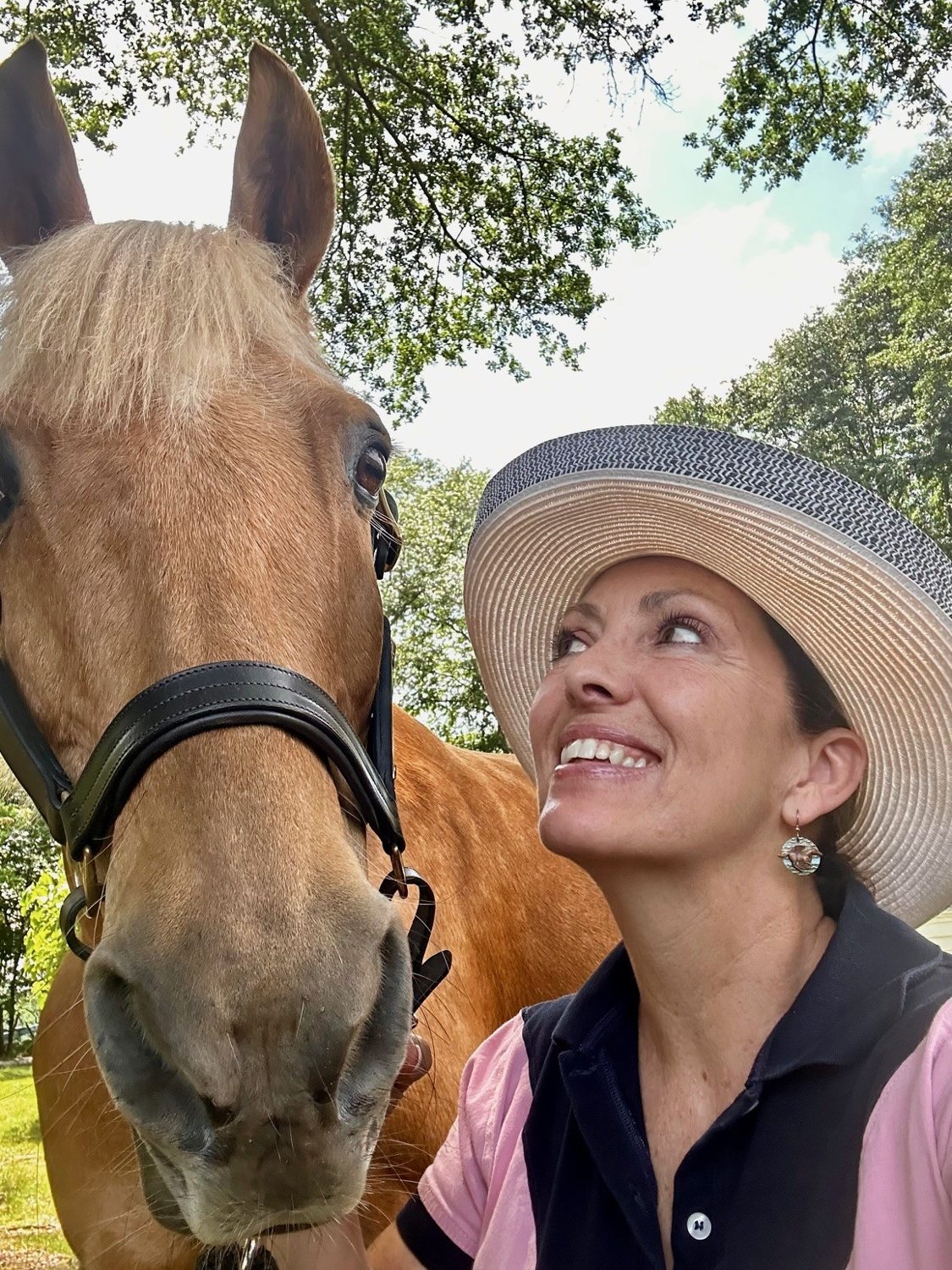 Jennifer outdoors with Buddy the horse